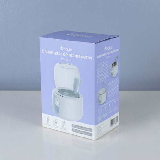 Calentador de mamaderas portátil Balia en su caja, ideal para viajes y uso en movimiento.