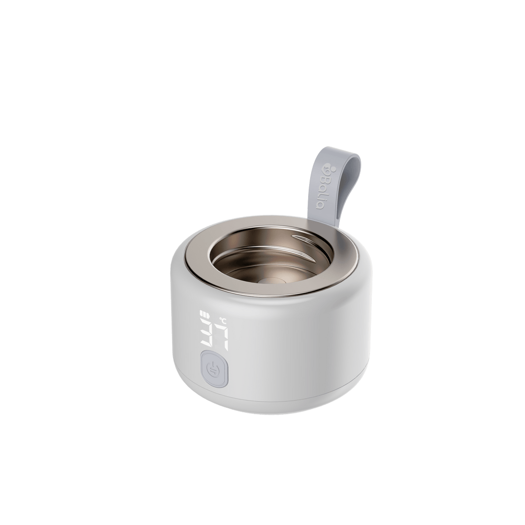 Calentador de mamaderas portátil Balia, ideal para viajes y compatible con diversas marcas de mamaderas.